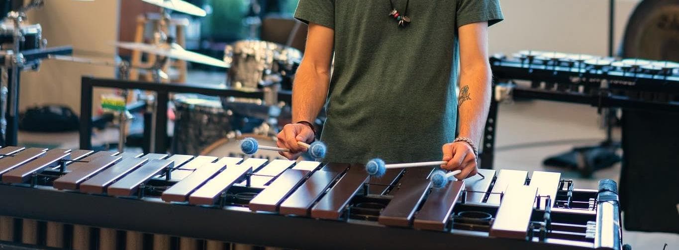 A young percussionist rehearsing on a keyboard percussion instrument